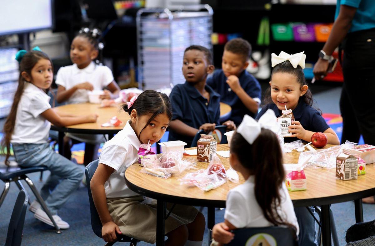 Children at T.A. Sims Elementary School start their first day of school with breakfast on Monday, August 14, 2023, in Fort Worth.
