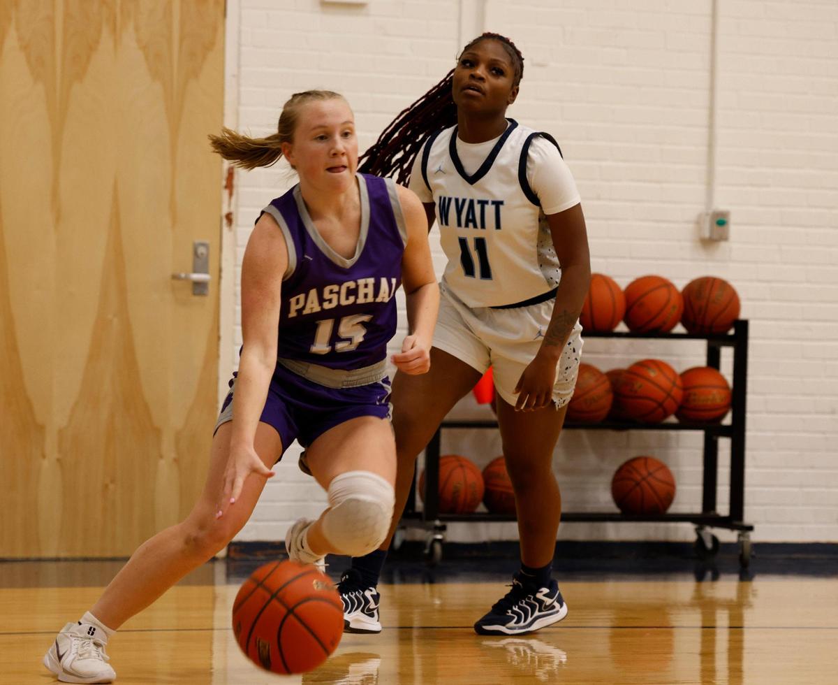 Paschal guard Annie Parsons (15) drives in front of O.D. Wyatt shooting guard Ka’myria Miller (11) during a UIL girls basketball game at O.D. Wyatt High School in Fort Worth, Texas, Friday, Jan. 24, 2025.