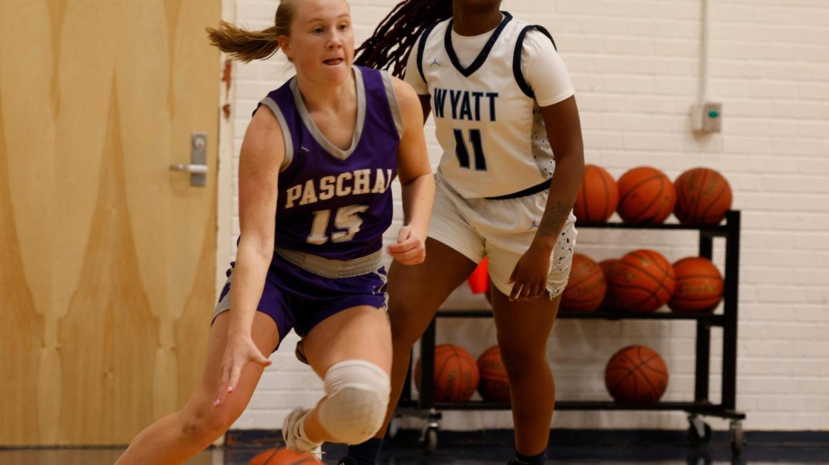 Paschal guard Annie Parsons (15) drives in front of O.D. Wyatt shooting guard Ka’myria Miller (11) during a UIL girls basketball game at O.D. Wyatt High School in Fort Worth, Texas, Friday, Jan. 24, 2025.