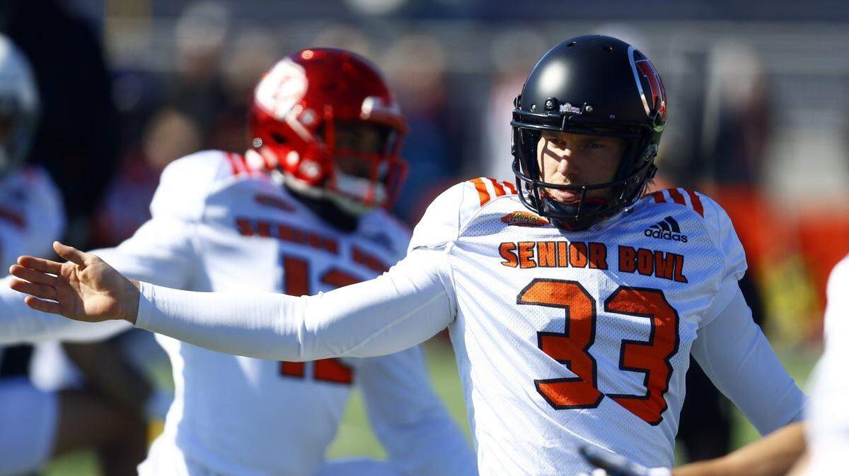 North punter Mitch Wishnowsky of Utah (33) stretches during practice for Saturday’s Senior Bowl college football game, Thursday, Jan. 24, 2019, in Mobile, Ala. (AP Photo/Butch Dill)