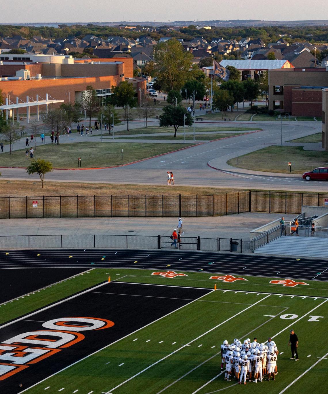 Homes and new construction surround Aledo High School as their football team takes the field on Friday, Oct. 7, 2022, in Aledo.