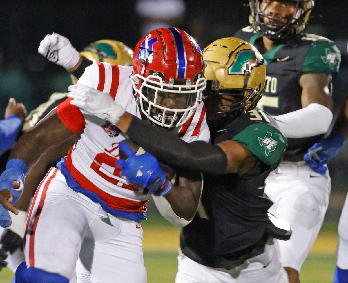 Duncanville running back JaQualon Armstrong (27) gets some hard yards up the middle during a District 11-6A football game at Eagle Stadium in DeSoto, Texas, Friday, Oct. 11, 2024.