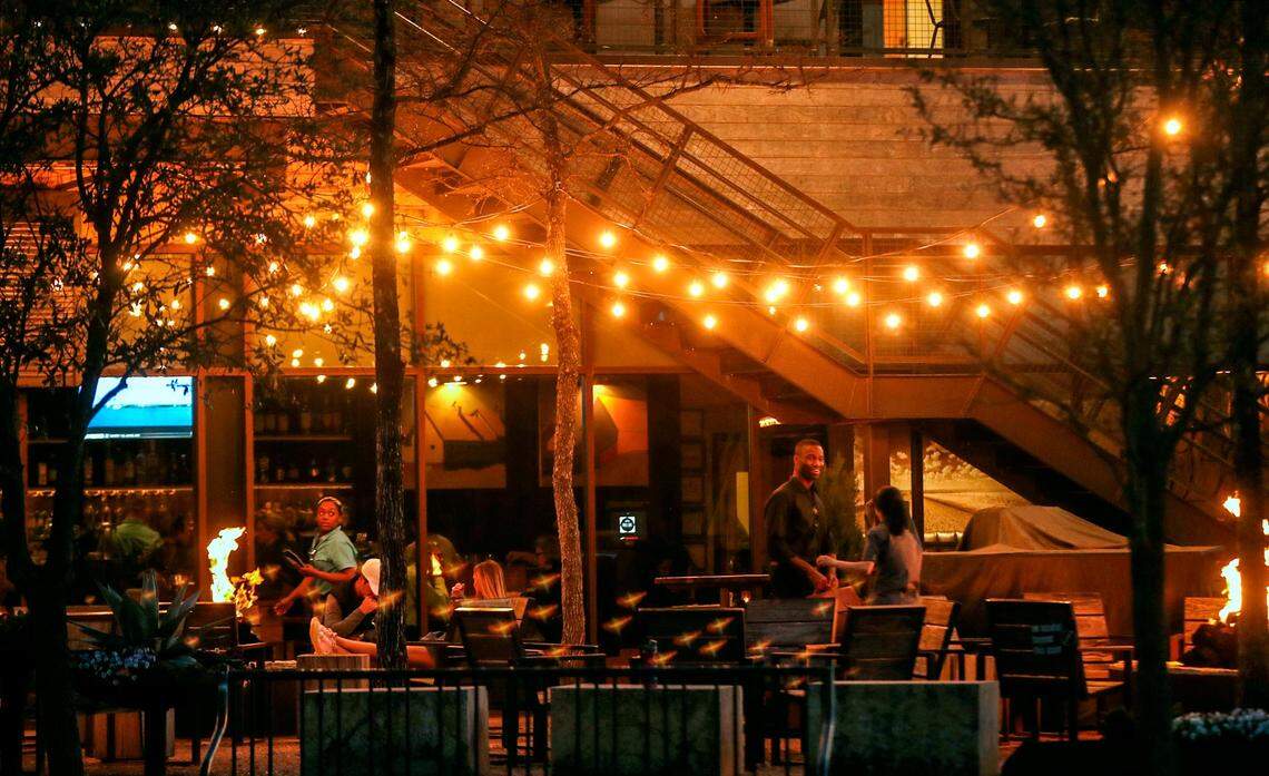 The patio at Press Cafe, located at The Trailhead at Clearfork, features fire pits and lighting for a pleasant evening.
