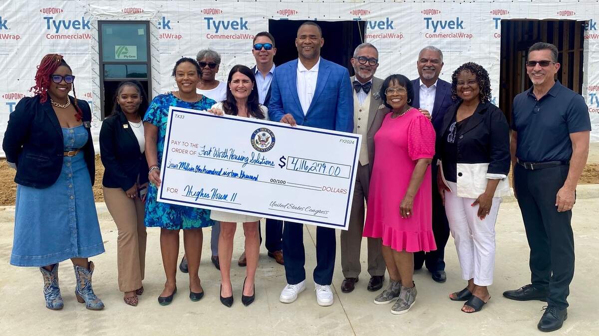 U.S. Rep. Marc Veasey at the Hughes House development with fellow members of the project.