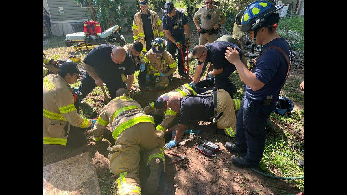 A missing Texas man was rescued by firefighters after he was found trapped underground in a septic tank, officials say.