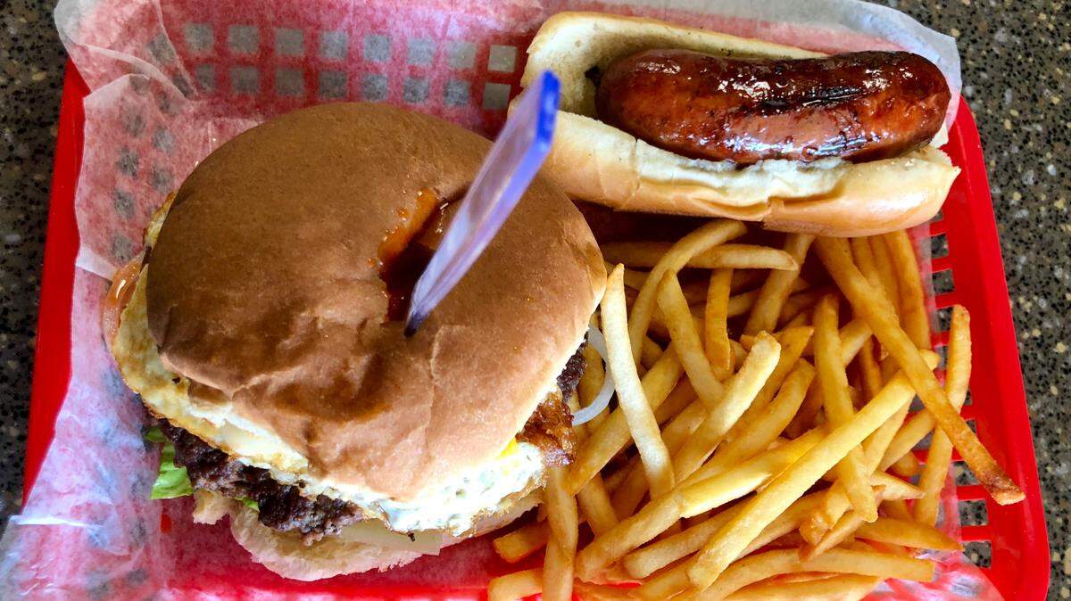 The “Crime Scene” burger at Burgers & Brats has jalapenos, cayenne, crushed jalapeno kettle chips, an egg and a trail of hot sauce across the bun.
