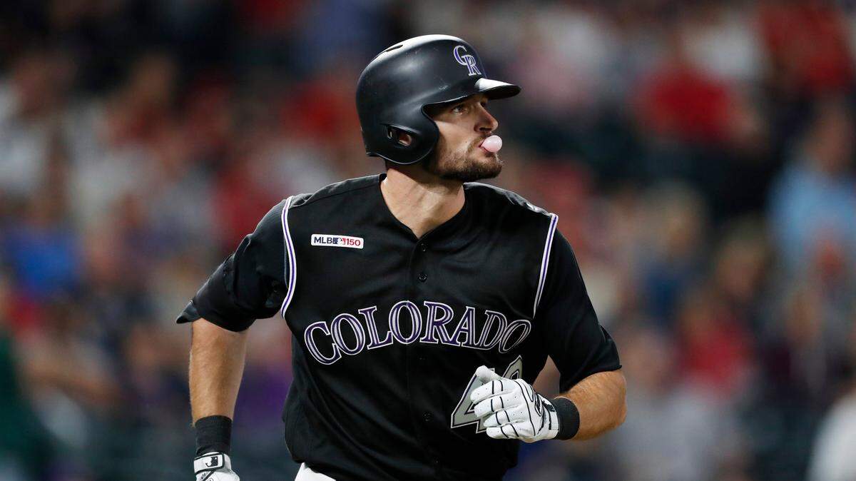 Former Mansfield High player Sam Hilliard blows a bubble as he heads down the first-base line after hitting a two-run home run Tuesday night for his first career hit.