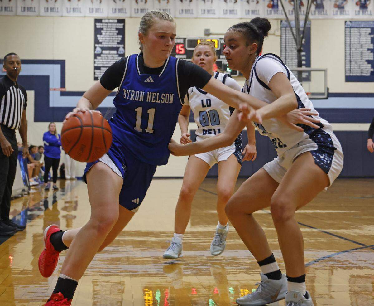 Byron Nelson guard Kinsey Morris (11) turns the corner on L.D. Bell guard QuaNesha Horn (3) during the first half of a girls UIL basketball game between Byron Nelson and L.D. Bell at L.D. Bell High School in Hurst, Texas, Friday Feb. 06, 2026