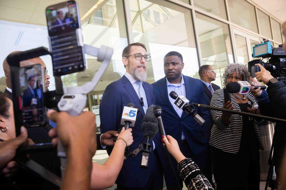 From left, Mike Howard, attorney for Karmelo Anthony, speaks to reporters as Dominique Alexander, president and CEO of Next Generation Action Network, stands next to him following a bond hearing in Anthony’s case at the Collin County Courthouse in McKinney, Texas, on Monday, April 14, 2025. Karmelo Anthony, 17, a Frisco Centennial High School student and football player, is accused of stabbing Austin Metcalf, also 17, to death at a track meet on April 2.