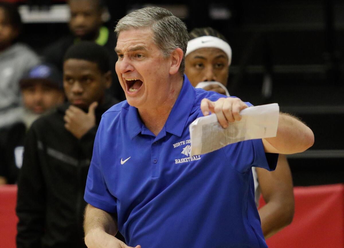 North Crowley’s Head Coach Tommy Brakel shouts instructions to his team during their Class 6A 1D Regional Semi Final game on Tuesday night at Coppell High School.