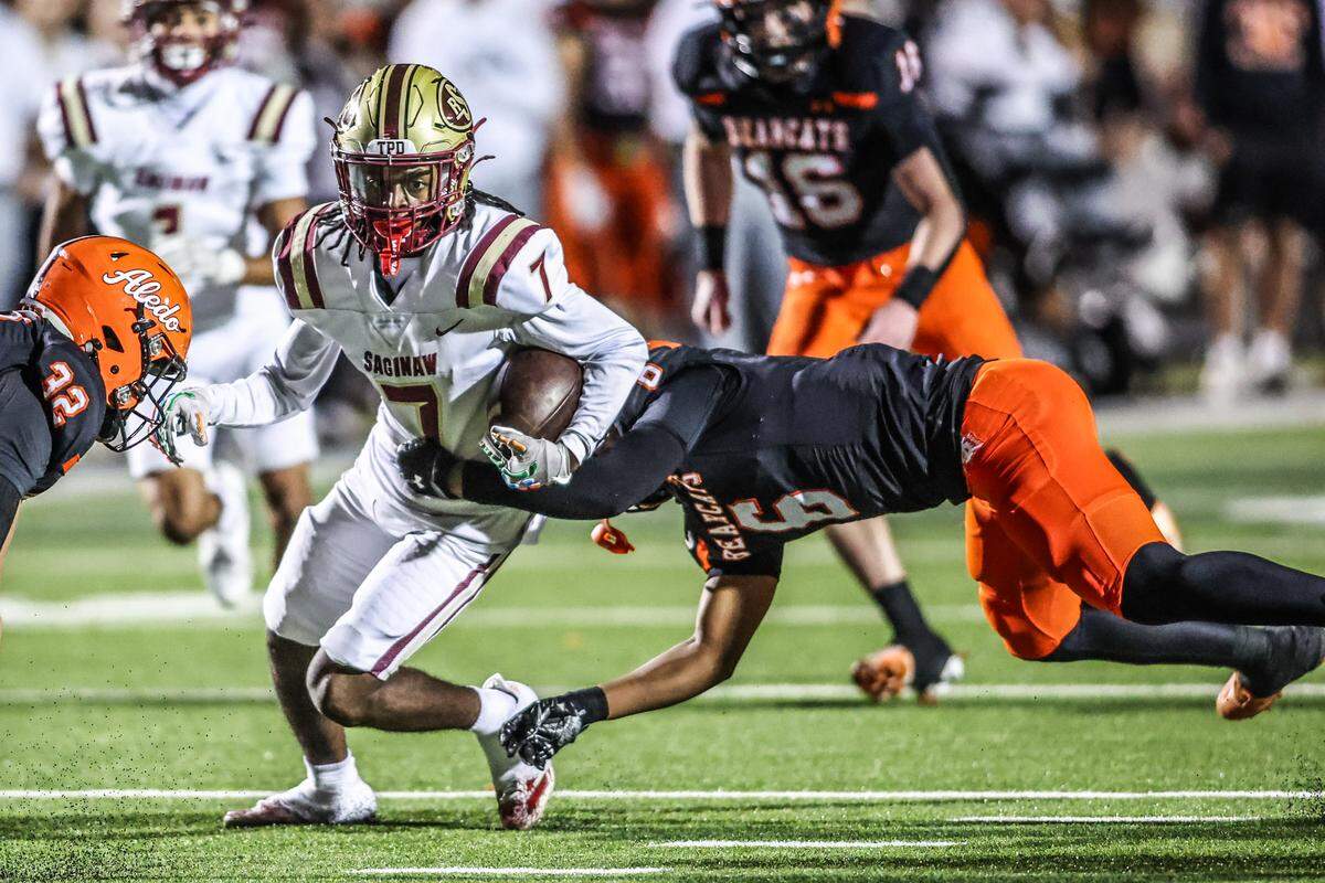 Saginaw receiver Kaiden Stewart (7) runs after a catch against Aledo in a Class 5A Division I bi-district playoff game on Thursday, November 13, 2025 at Tim Buchanan Stadium in Aledo, Texas.