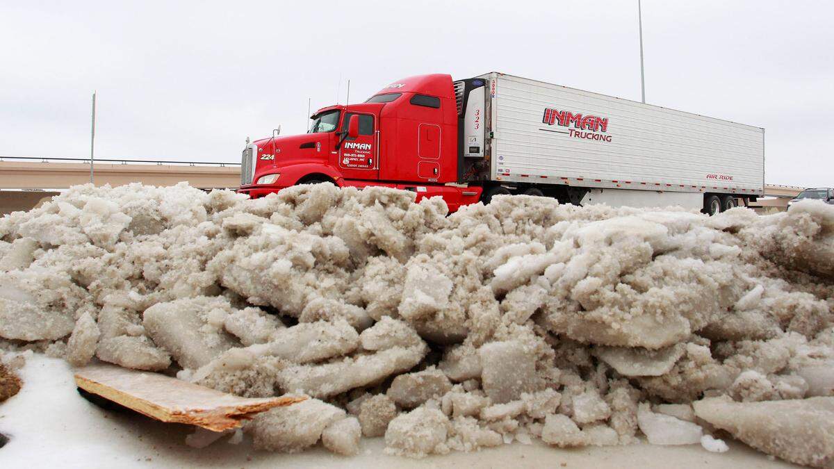 Ice piled on the shoulder of I-20 near Hulen Mall in Fort Worth. Cold and ice remained in Fort Worth Sunday, with roads especially treacherous in the the morning hours before temperatures rose, Sunday, December 8, 2013. (Star-Telegram/Paul Moseley)