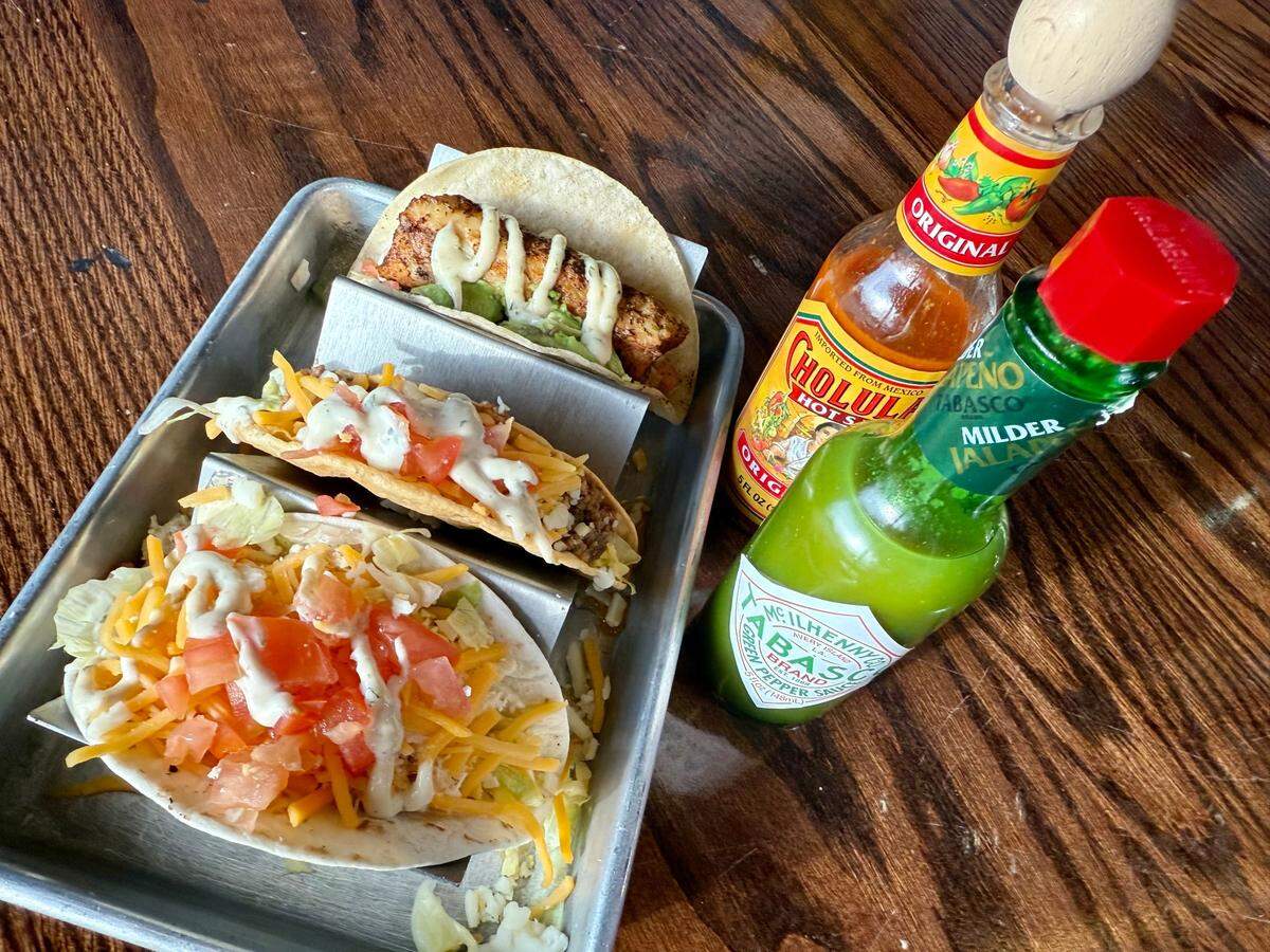 A chicken flour taco, beef crispy taco and fish taco on corn at the Poop Deck Bar and Grill, as seen May 13, 2025.