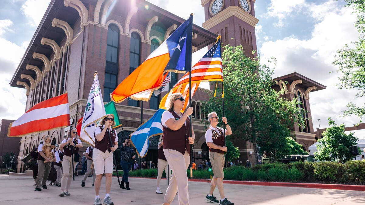 Grapevine Spring Wine Trail participants take part in the World’s Smallest Parade, part of the day’s festivities.