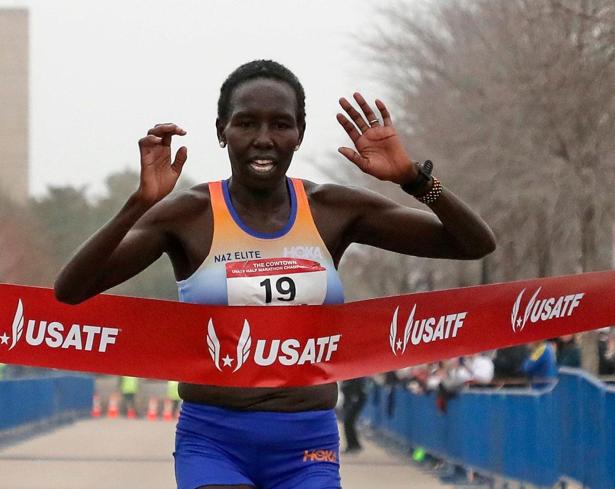 Aliphine Tuliamuk wins the half marathon for the USA Track & Field championship with a time of 1:09.36 during the 2023 Cowtown Marathon in Fort Worth, Texas, Sunday, Feb. 26, 2023. Almost 21,000 runners registered for the two day event. (Special to the Star-Telegram Bob Booth)