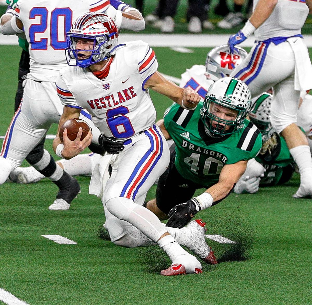 Austin Westlake quarterback Cade Klubnik (6) tries to avoid getting stopped by Southlake Carroll linebacker Allan Kleiman (40) during the first half.