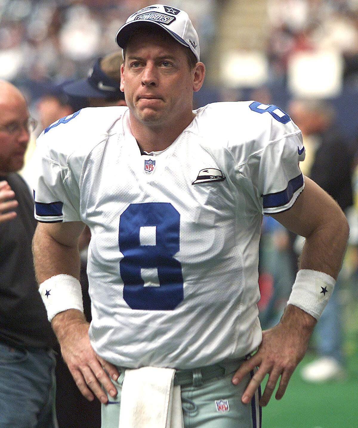 Dallas Cowboys quarterback Troy Aikman walks the sidelines.