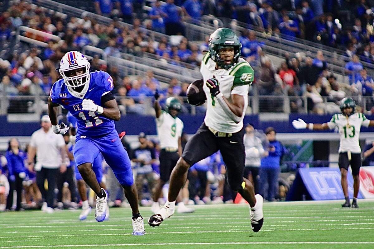 DeSoto wide receiver Ethan Feaster (1) moves up field after a catch against Houston King in the Class 6A Division II state championship game on Saturday, Dec. 20, 2025 at AT&T Stadium in Arlington, Texas.