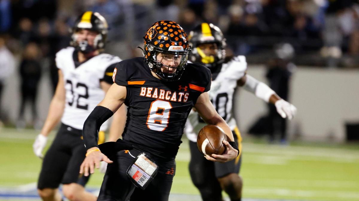 Aledo quarterback Hauss Hejny (8) runs the ball downfield during the first half of a UIL Conference 5A Division I semifinal football playoff game at Midlothian ISD Stadium in Midlothian on Dec. 8.