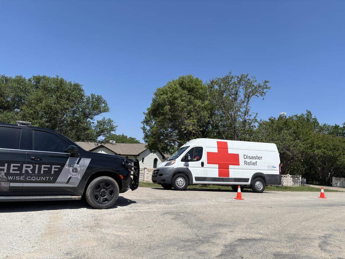 A Red Cross Disaster Relief van enters a Runaway Bay neighborhood impacted by an EF-2 tornado on April 27, 2026. Streets were blocked by Wise County Sheriff’s Department vehicles in the days following the storm.