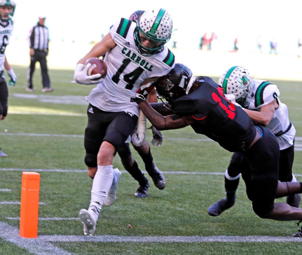 Southlake’s Brady Boyd puts in their fourth touchdown defended by Trinity defensive back Jacob Schaeffer (13) during the 6A division 1 quarterfinals at Globe Life Park in Arlington, Texas, Saturday, Jan. 02, 2021. Southlake led Trinity 38-21 at the half. (Special to the Star-Telegram Bob Booth)