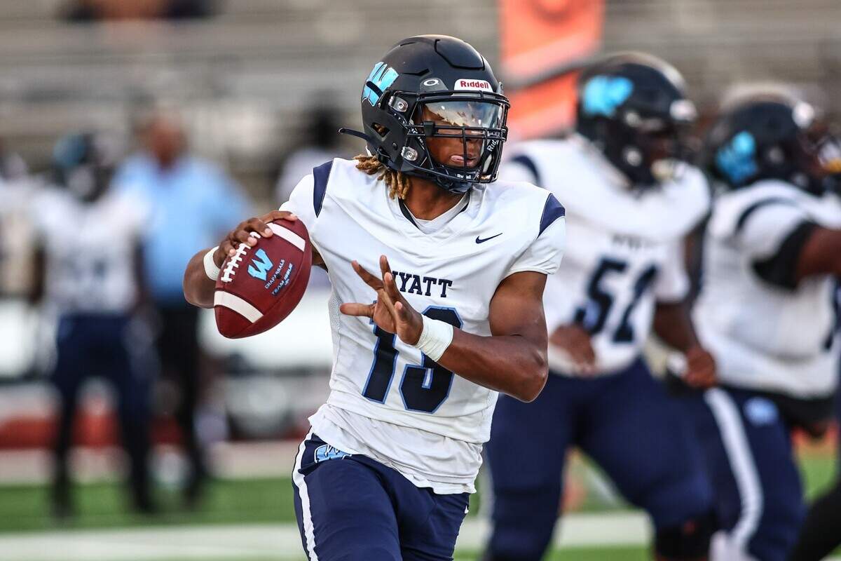 Wyatt quarterback Jorvorskie Lane, Jr. rolls out and looks to pass against Dunbar on Thursday, September 5, 2024 at Clark Stadium in Fort Worth, Texas. Dunbar rallied to defeat Wyatt 14-13.