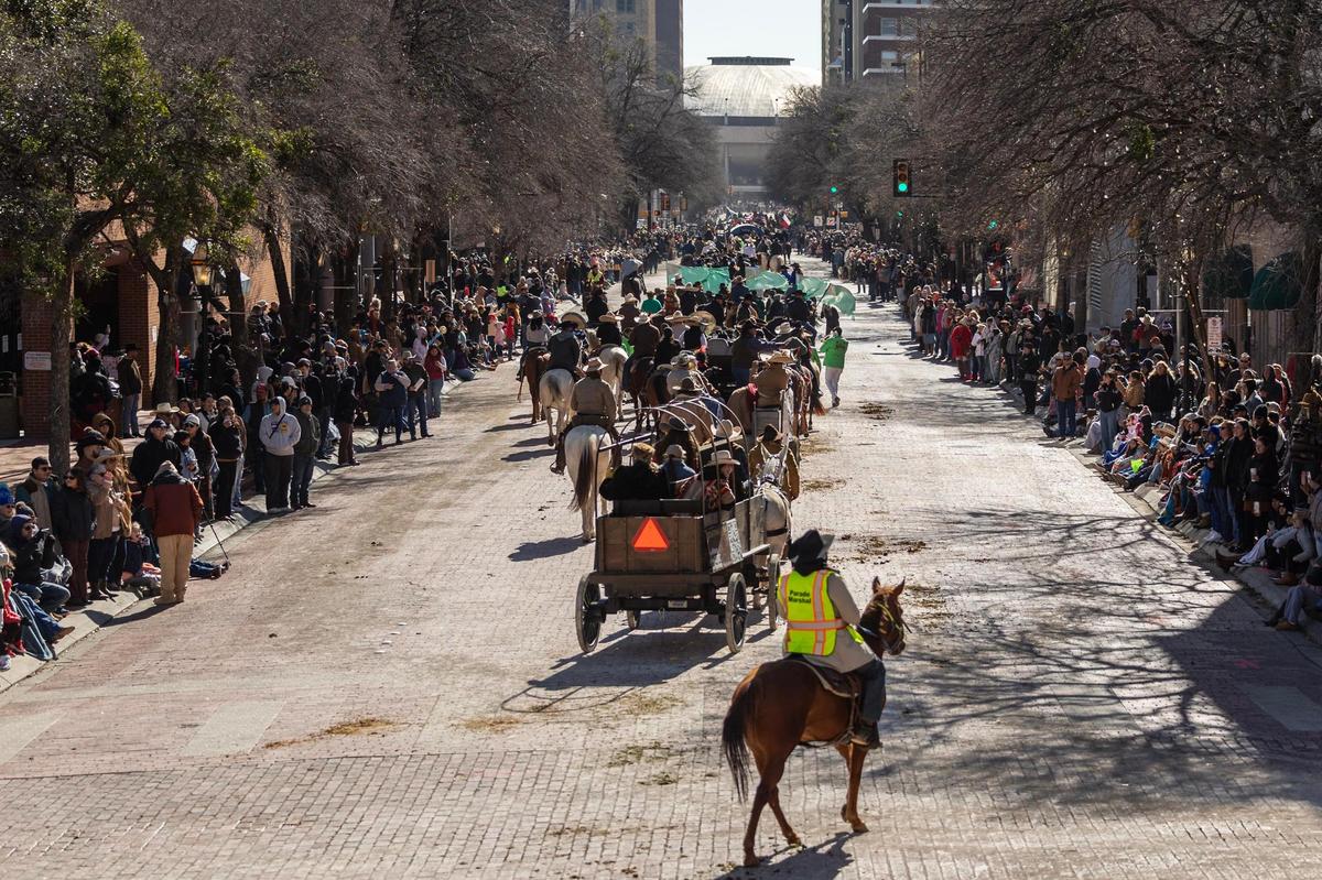 Parade participants make their way down Main Street surrounded by hundreds of spectators for the Fort Worth Stock Show All Western Parade down Main Street in downtown Fort Worth on Saturday, Jan. 18, 2025.