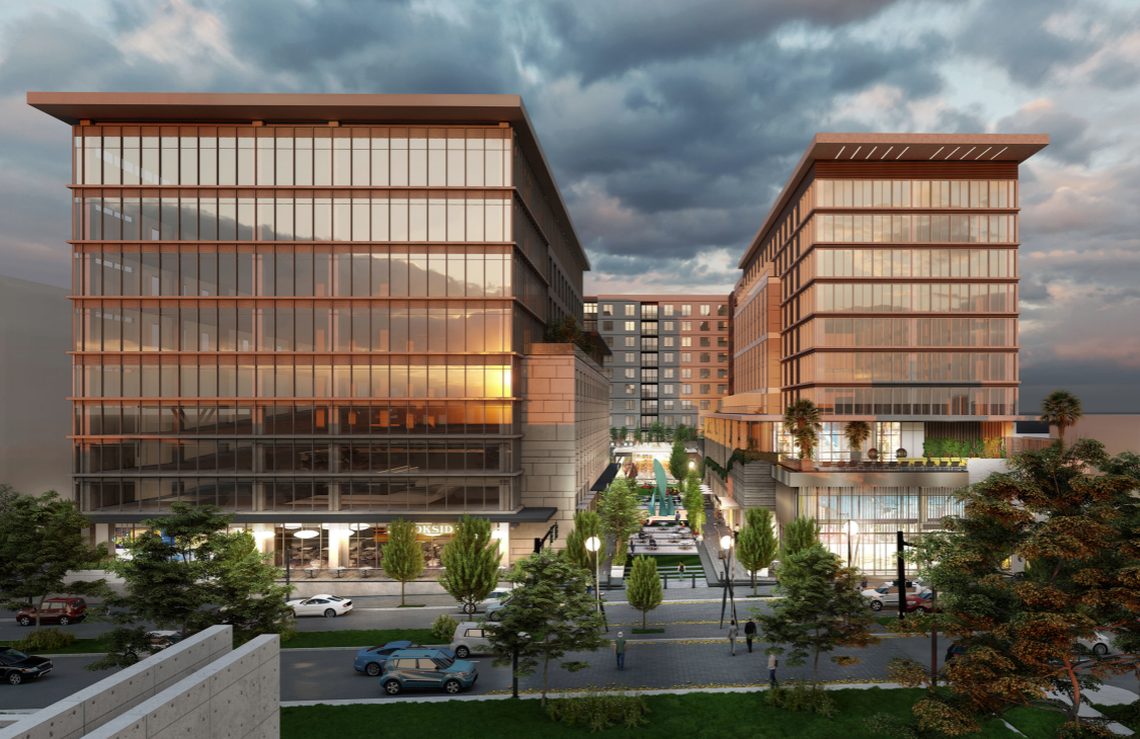 A rendering of a glass office/apartment tower