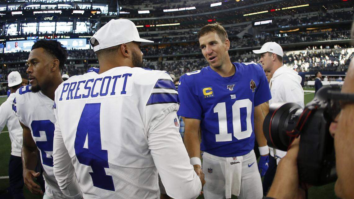 Dallas Cowboys’ Dak Prescott (4) and New York Giants’ Eli Manning (10) greet each other after their NFL football game in Arlington, Texas, Sunday, Sept. 8, 2019. (AP Photo/Ron Jenkins)