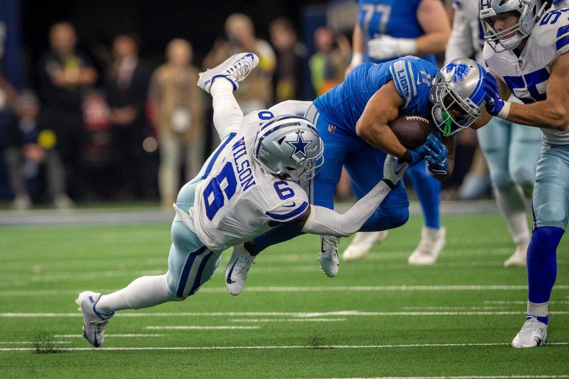 Dallas Cowboys safety Donovan Wilson brings down Detroit Lions wide receiver Kalif Raymond during Sunday’s game at AT&T Stadium. The Cowboys defense produced five turnovers during the 24-6 victory.