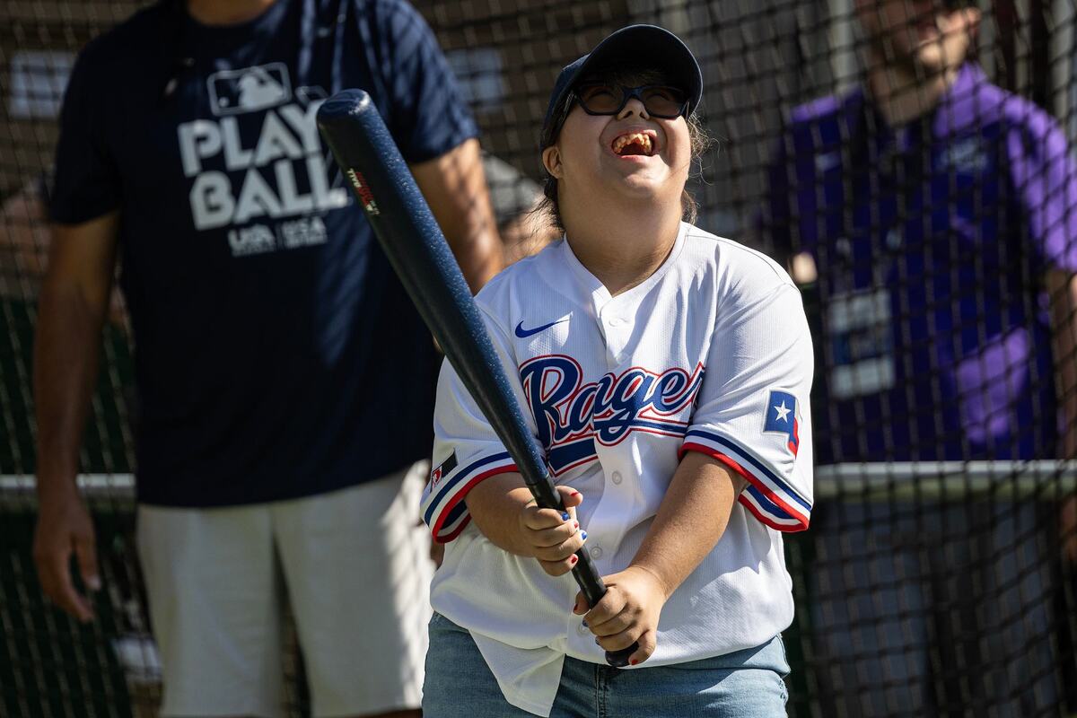 Audrianna Ceballos, 15, laughs in excitement as she steps up to the plate to play a game in the Play Ball Field for the first day of the 2024 MLB All-Star Village at Choctaw Stadium in Arlington on Saturday, July 13, 2024.