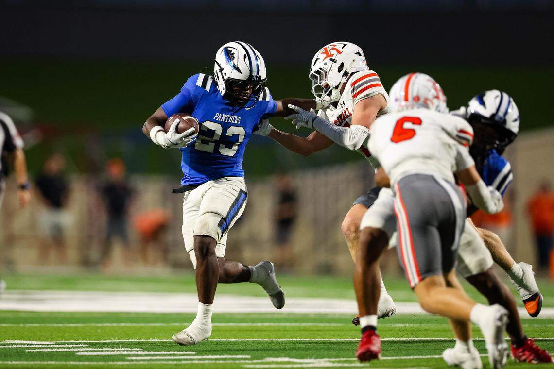 North Crowley running back Kiante Ingram stiff-arms a Rockwall defender in a non-district game between North Crowley and Rockwall at Crowley ISD Stadium in Crowley, Texas on Sept. 18, 2025.
