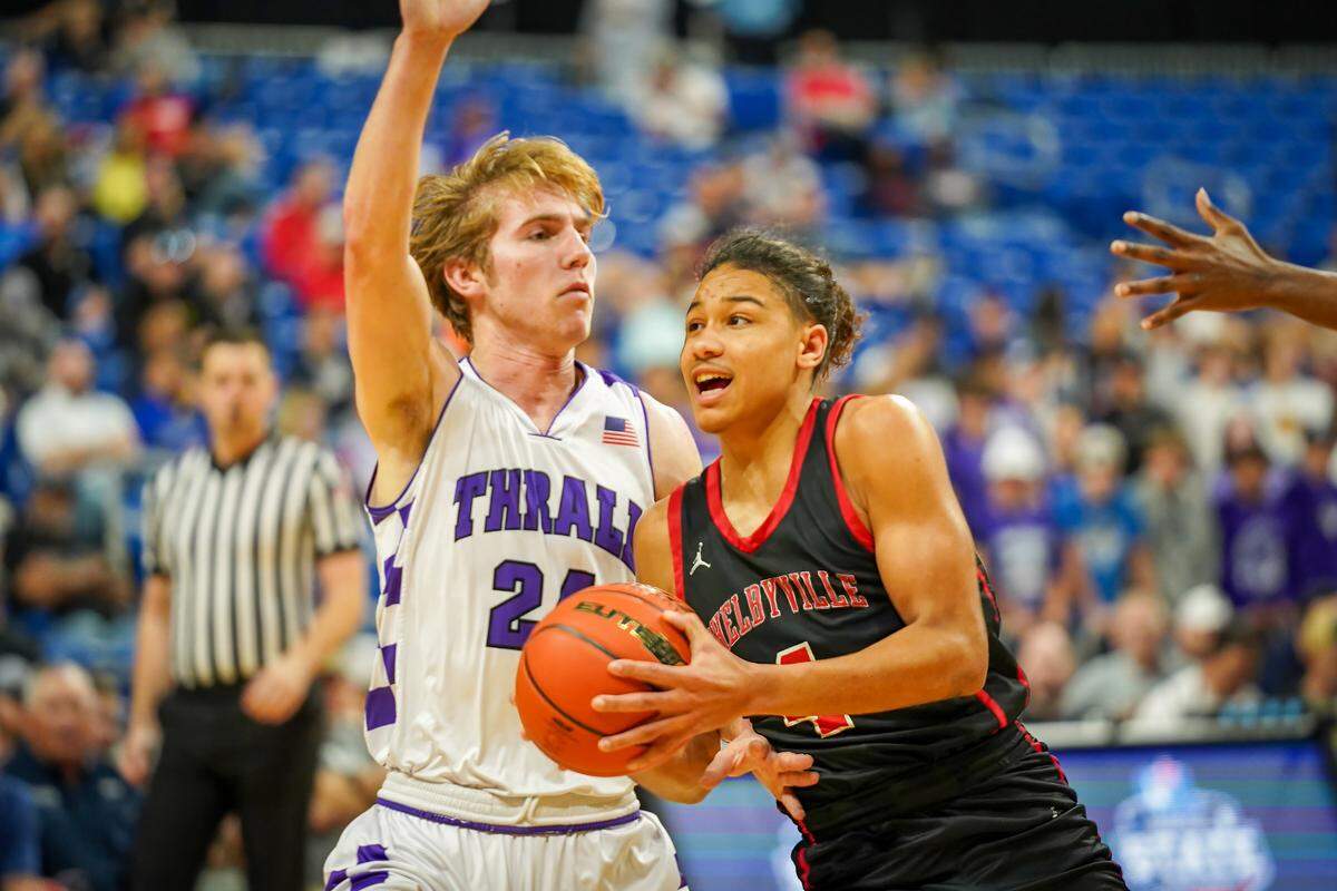 Shelbyville’s Ja’Davian Mathis goes to the basket against Ethan Dahl of Thrall in a Class 2A state semifinal on Friday, March 8, 2024 at the Alamodome in San Antonio, Texas. Shelbyville defeated Thrall 67-52.