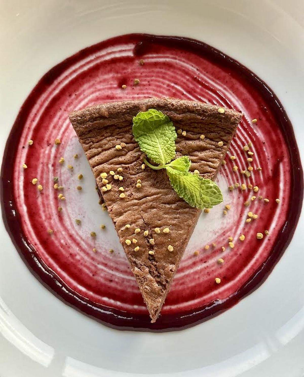 “Fallen” chocolate cake with blueberry-rose coulis and bee pollen at James Provisions.