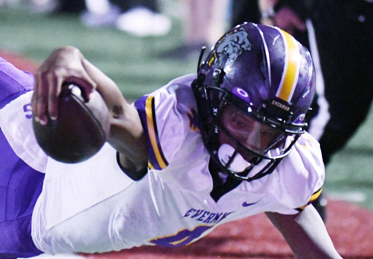 Everman quarterback Jarion Basped tries to get the ball over the goal line as he falls just short of the touchdown against Burleson in the first quarter of Thursday’s October 13, 2022 District 5-5A Division 2 football game at Burleson ISD Stadium in Burleson, Texas. Everman was able to score on the next play to take a 21-6 lead. Special/Bob Haynes