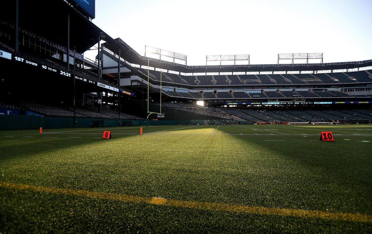 The sun slants onto the football field at Globe Life Park on Thursday, September 24, 2020. Arlington Lamar High took on Euless Trinity to start a series of high school football games Globe Life Park will host this season.