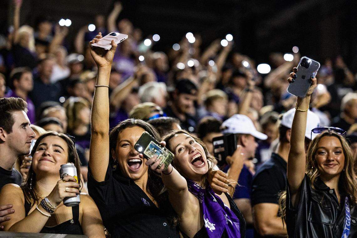 TCU fans put up their phone flashlights to ‘light up the night’ for a Big XII conference game between the TCU Horned Frogs and the West Virginia Mountaineers at Amon G. Carter Stadium in Fort Worth on Saturday, Sept. 30, 2023.