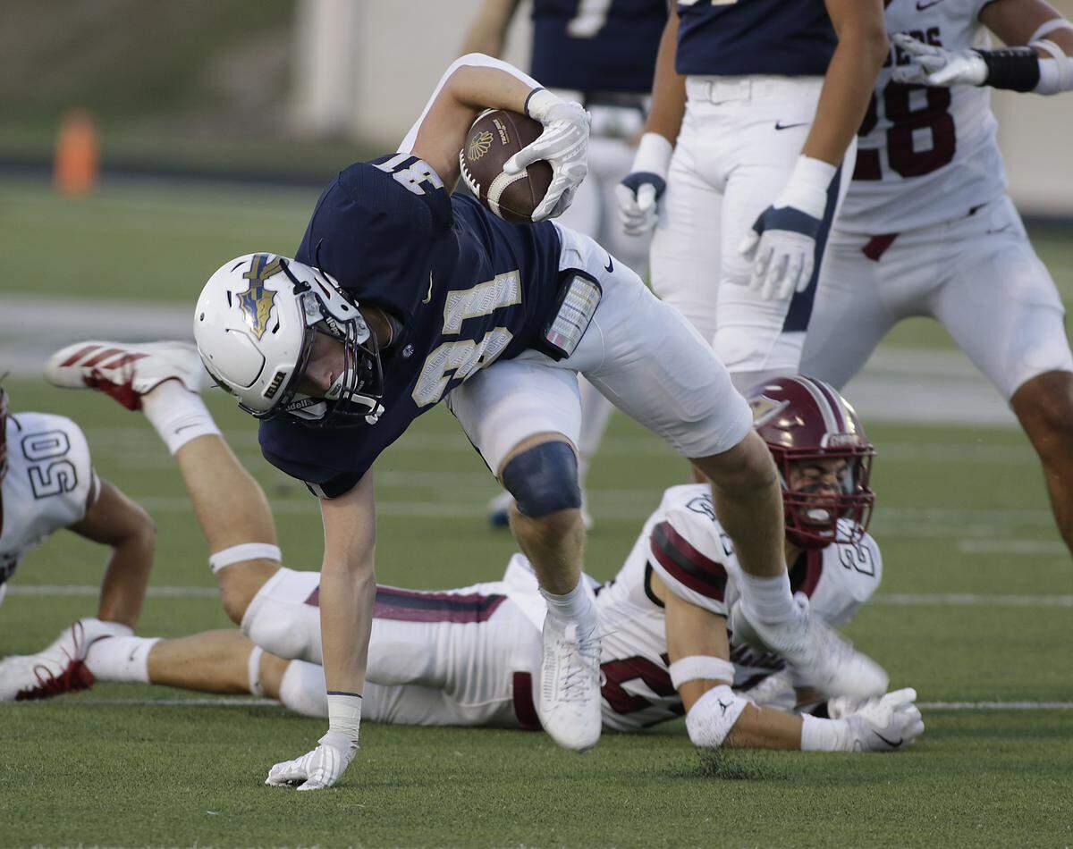 Keller’s Blake Dyniewski (31) is almost brought down by the Keller Central defense during their game at Keller ISD Athletic Complex on Friday, Sep. 26, 2025.