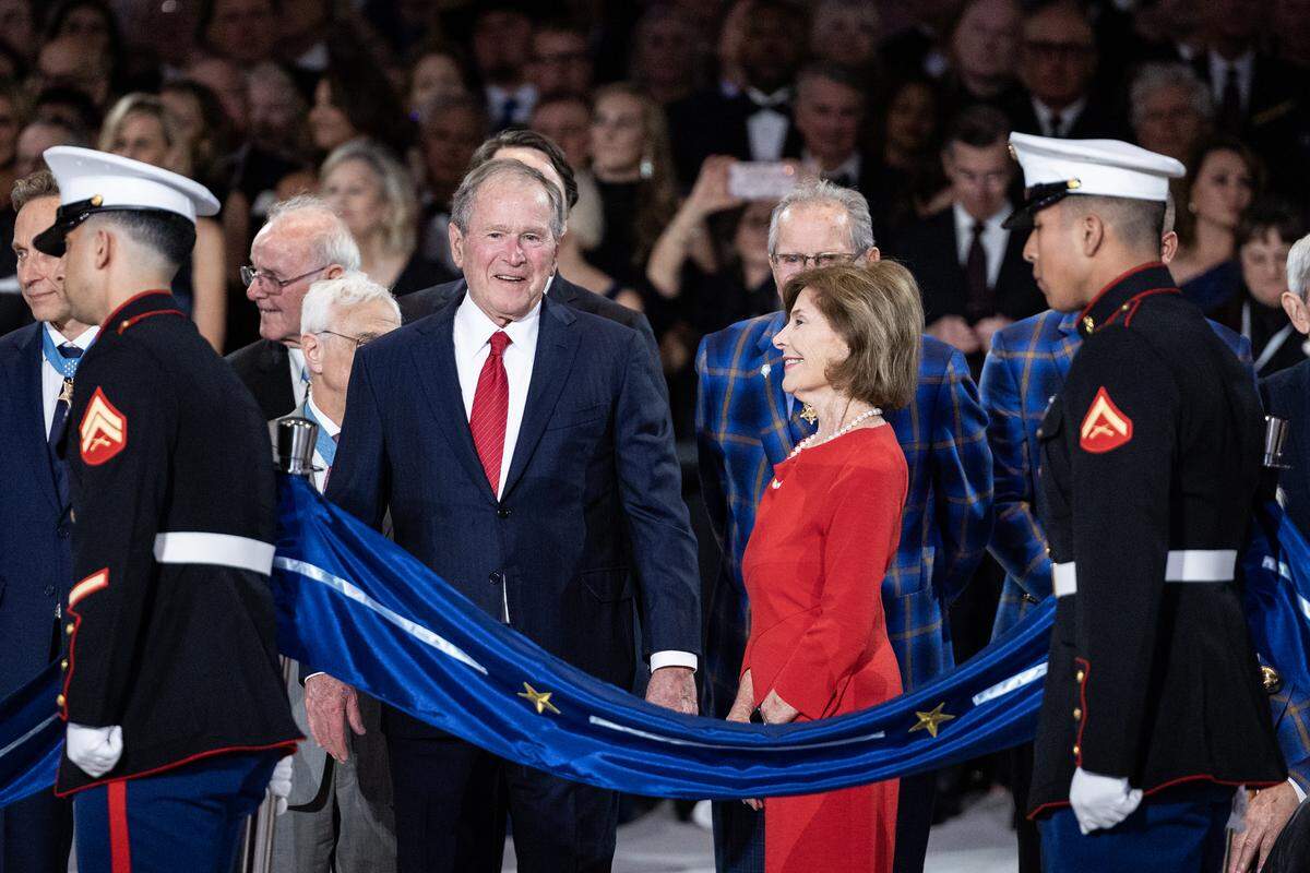 President George W. Bush and his wife Laura arrive for the ribbon cutting ceremony for the National Medal of Honor Museum Grand Opening Celebration in the Arlington Entertainment District on Saturday, March 22, 2025.