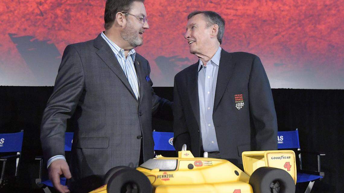 Texas Motor Speedway president Eddie Gossage presents three-time Indianapolis 500 winner Johnny Rutherford with an IndyCar-shaped birthday cake to celebrate his 80th birthday at the TMS Media Day at Texas Motor Speedway in Fort Worth, TX, Wednesday, Feb. 28, 2018.
