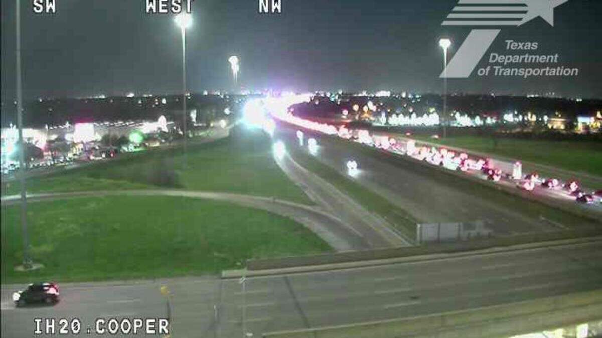 A still image from a TxDOT traffic camera shows traffic on Interstate 20 near Cooper Street on Saturday night March 22, 2025. Police say a 22-year-old man was killed in a crash at I-20 and Bowen Road, and the driver who hit his car has been arrested on suspicion of drunk driving and collision involving death.