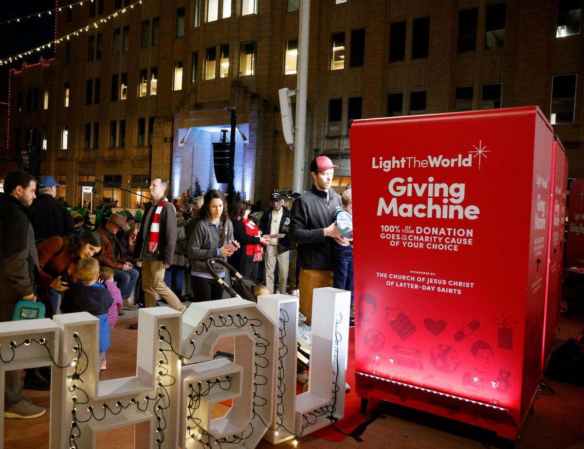 Several people gathered around and donated to the Giving Machine before Fort Worth’s lighting of the 77th Annual Fort Worth Community Christmas Tree in Sundance Square plaza. The Giving Machines offer a cashless way to give donations to regional and global nonprofits.