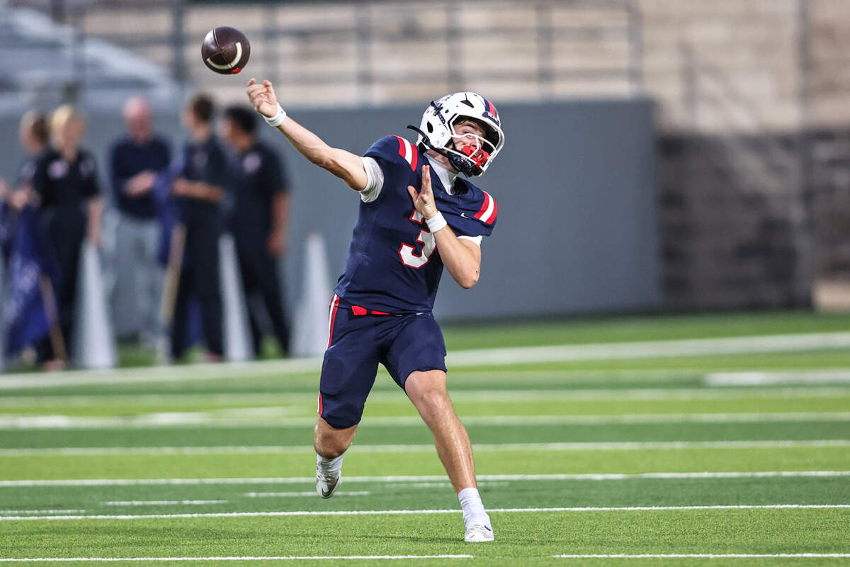 Richland quarterback Brett Kates throws a touchdown pass against Birdville in the Friday, Sept. 26, game at Birdville ISD FineArts/Athletics Complex.