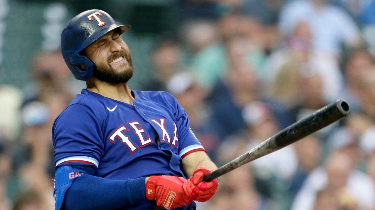 Texas Rangers’ Joey Gallo reacts after hitting a fly ball for an out during the fourth inning of Monday’s 14-0 loss to the Tigers in Detroit.