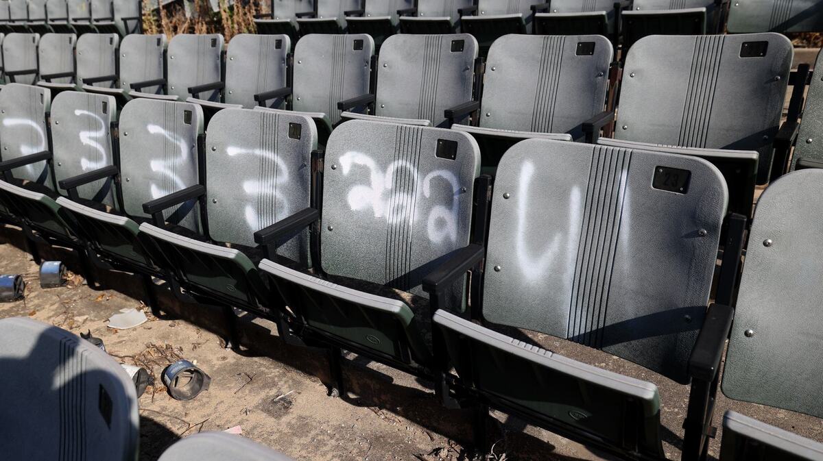 Grafiti covered stadium seats in an abandoned minor league baseball stadium. 