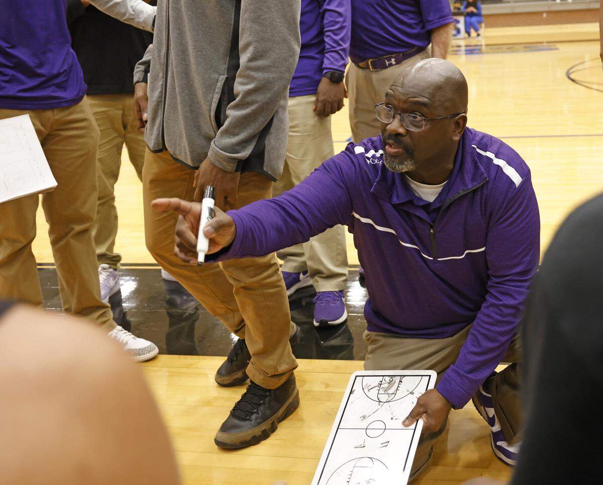 Everman head coach Jon Wagner talks to the team during a timeout against Mansfield Summit in the first half of a UIL boys basketball game between Everman and Mansfield Summit at Summit High School in Mansfield, Texas, Thursday Jan. 22, 2026