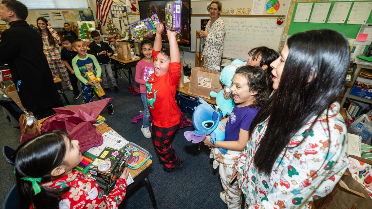 Second-graders see their Christmas presents on at Alice Contreras Elementary School in Fort Worth in December. After booming for years, school districts in Texas are seeing flat or declining enrollment.