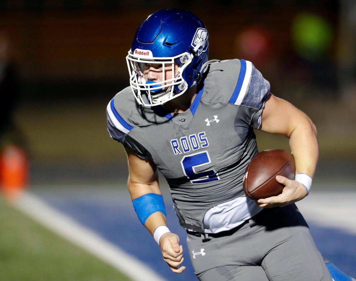 Weatherford quarterback Ryan Clark (5) runs a keeper up the left side for yardage in a District 3-6A high school football game at Kangaroo Stadium in Weatherford, Texas, Friday Oct. 22, 2021. Trinity led 28-7 at the half. (Special to the Star-Telegram Bob Booth)