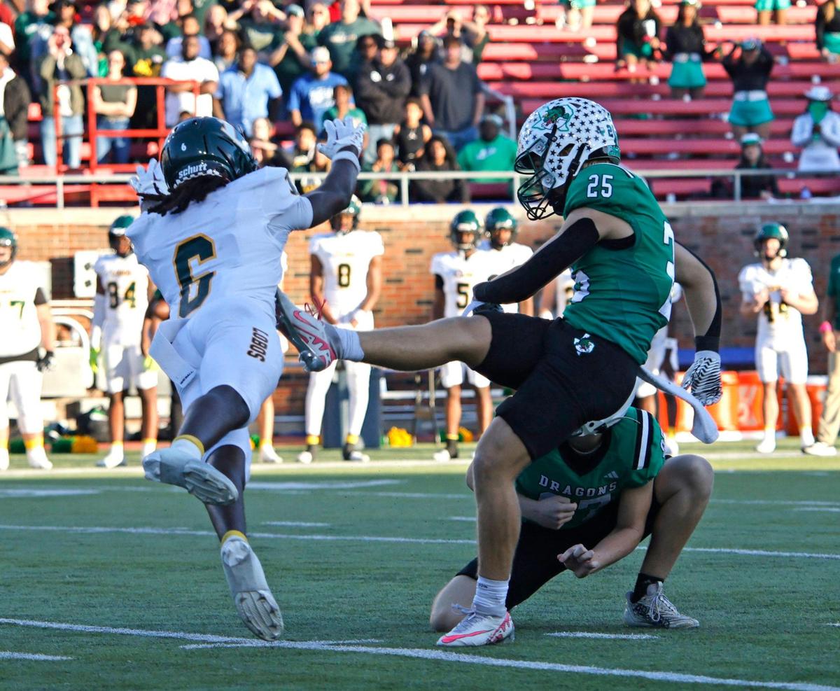 Longview defensive back Da’Kayden Carter (6) is called for running into the kicker on a failed field goal attempt by Southlake Carroll kicker Gavin Strange (25) giving the Dragons a second chance during the UIL 6A D2 Semifinals football game at Gerald J. Ford Stadium in University Park, Texas, Saturday, Dec. 14, 2024.