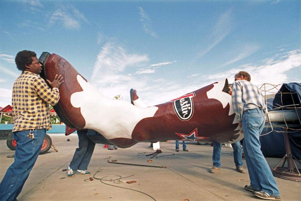 Sept. 25, 1990: Workers fit Big Tex, the 52-foot-tall mascot of the State Fair of Texas, with new Justin boots ahead of the fair at Fair Park in Dallas.